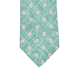 A Green Medallion Print Linen Lined Tie with white flowers on it by Amanda Christensen.