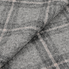 Close-up of the Grey Blue Checked Virgin Wool Scarf by Amanda Christensen. Made in Italy, this pure virgin wool accessory is slightly folded, revealing its texture and exquisite design.