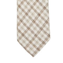 A close-up of a Brown Checked Wool Silk Lined Tie with a brown and white checkered pattern, by Amanda Christensen.