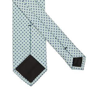 A Light Green Micro Jacquard Woven Silk Lined Tie with polka dots on a white background, crafted in Italy by Amanda Christensen.