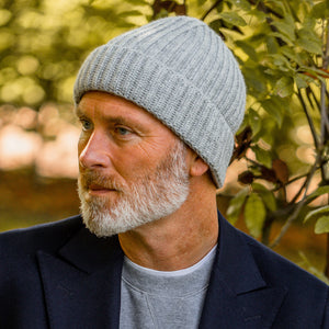 A man with a beard wearing an Amanda Christensen Light Grey Ribbed Cashmere Beanie.