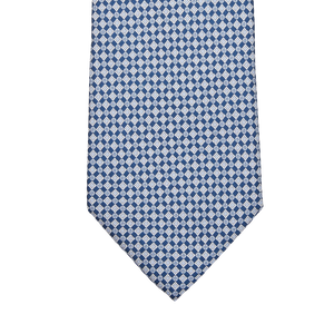 A navy blue micro medallion printed silk lined tie by Amanda Christensen on a white background.