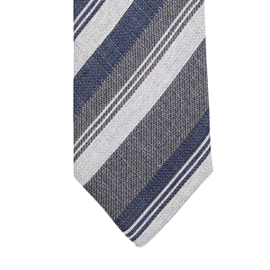 A close up of a Blue Grey Striped Silk Lined Tie by Amanda Christensen.