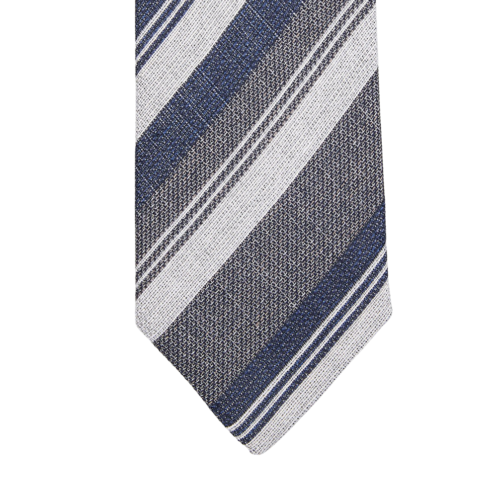 A close up of a Blue Grey Striped Silk Lined Tie by Amanda Christensen.