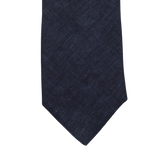 An Amanda Christensen Navy Blue Linen Lined Tie on a white background.