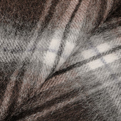 Close-up of a soft, brown and grey plaid fabric with a fuzzy texture, reminiscent of an Amanda Christensen Brown Checked Virgin Wool Scarf.