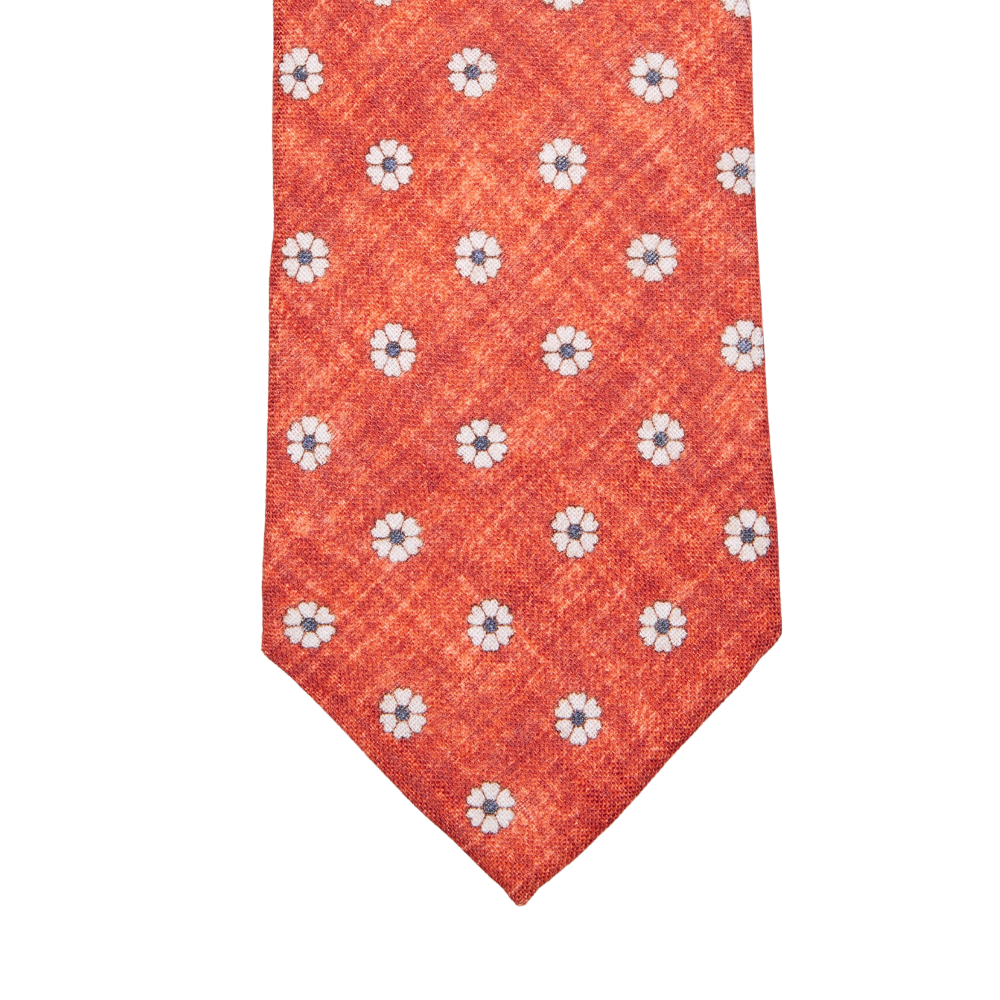 A Amanda Christensen red tie with an Orange Flower Printed Linen Lined on it.