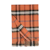 The Orange Checked Virgin Wool Scarf by Amanda Christensen is an orange and black plaid scarf with fringed ends, crafted from pure virgin wool.