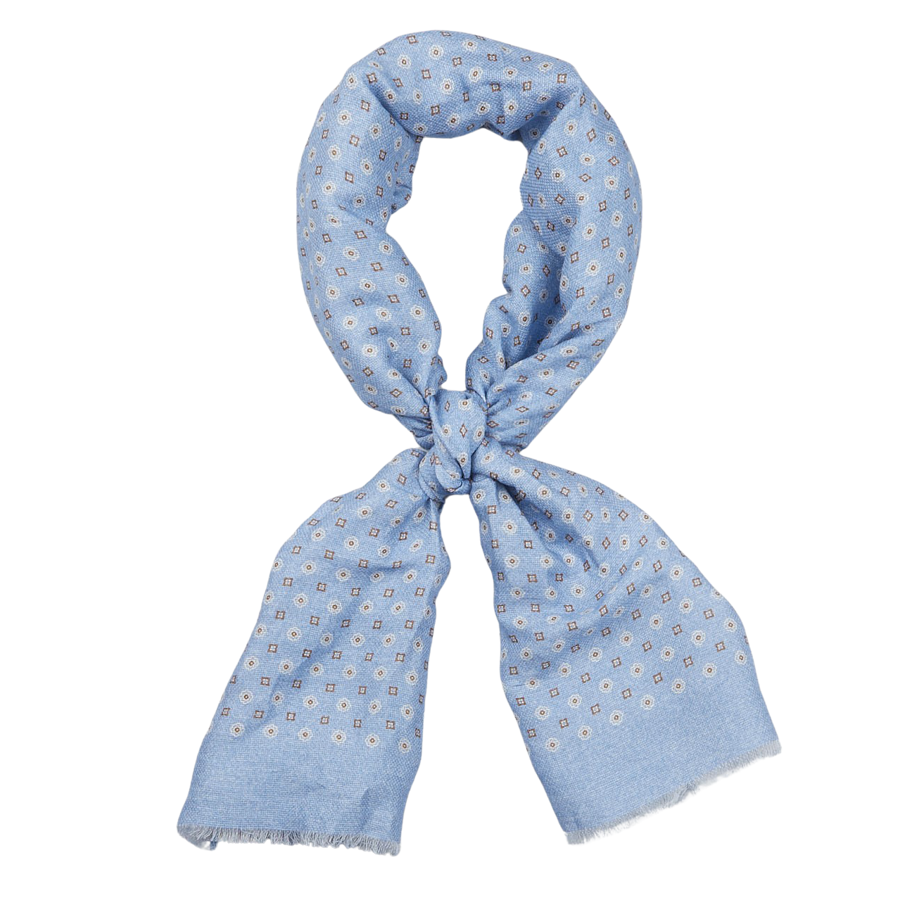 Amanda Christensen sky blue medallion printed cotton linen scarf with fringe tied in a knot against a white background.