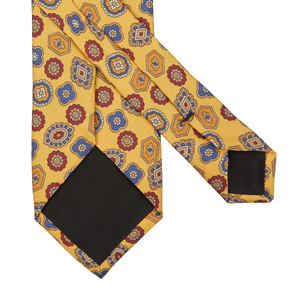 A Yellow Geometrical Printed Silk Lined Tie with a geometrical pattern by Amanda Christensen.