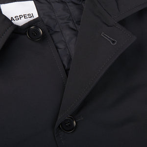 A close up of an Aspesi Navy Blue Cotton Thermore Impermeabile Coat with a label on it.