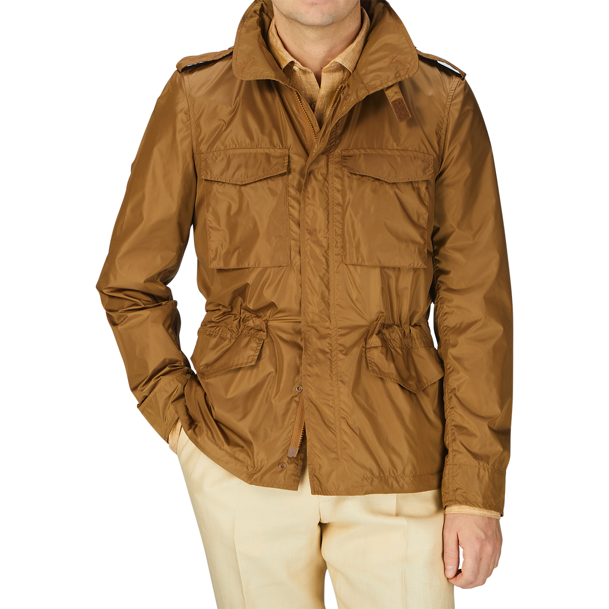 A man wearing a tan Aspesi Amber Brown Recycled Nylon Field Jacket.
