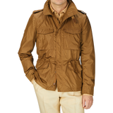 A man wearing a tan Aspesi Amber Brown Recycled Nylon Field Jacket.