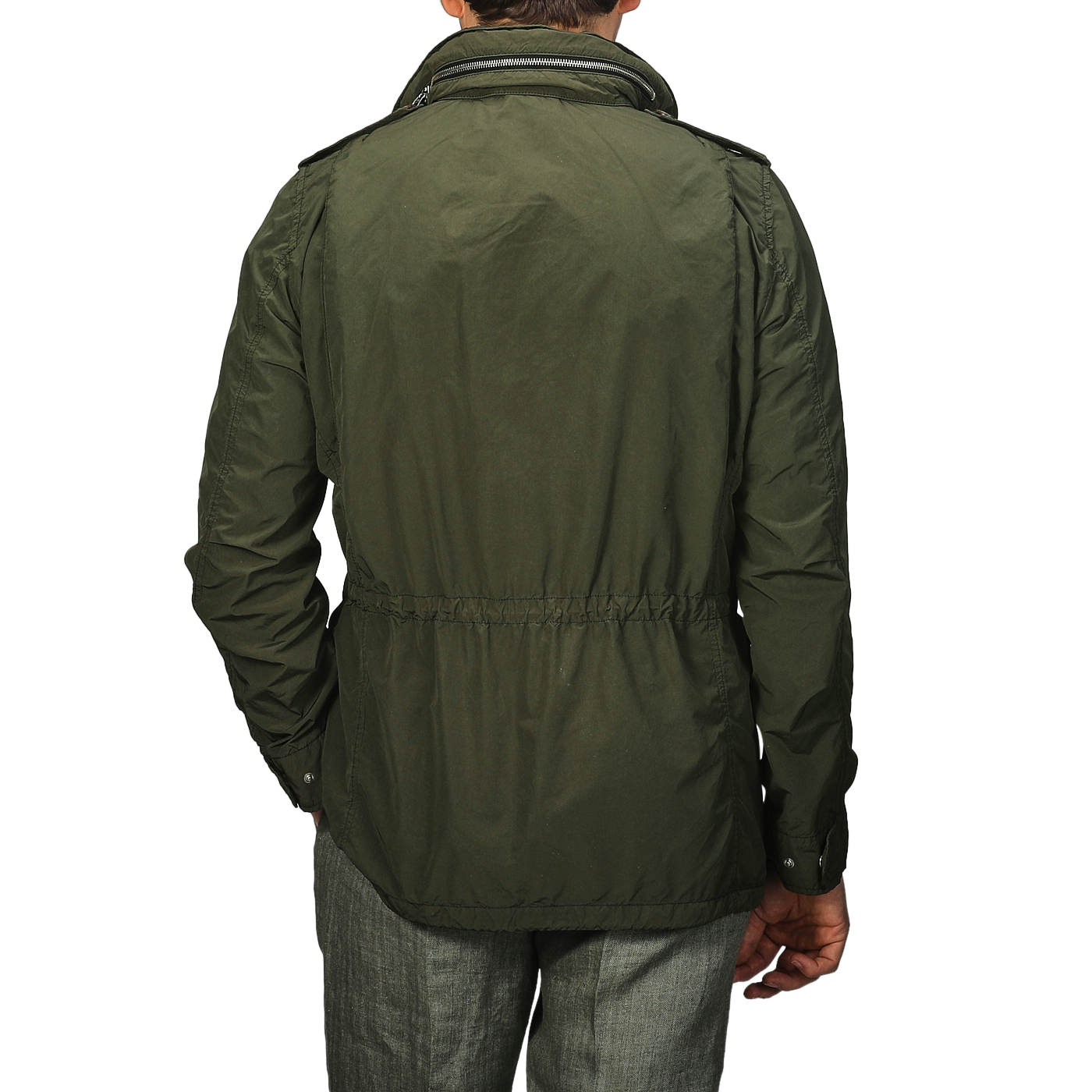 A person is seen from behind wearing Aspesi's Army Green Luxury Nylon Field Jacket featuring long sleeves and an adjustable waist, paired with grey pants against a plain background.