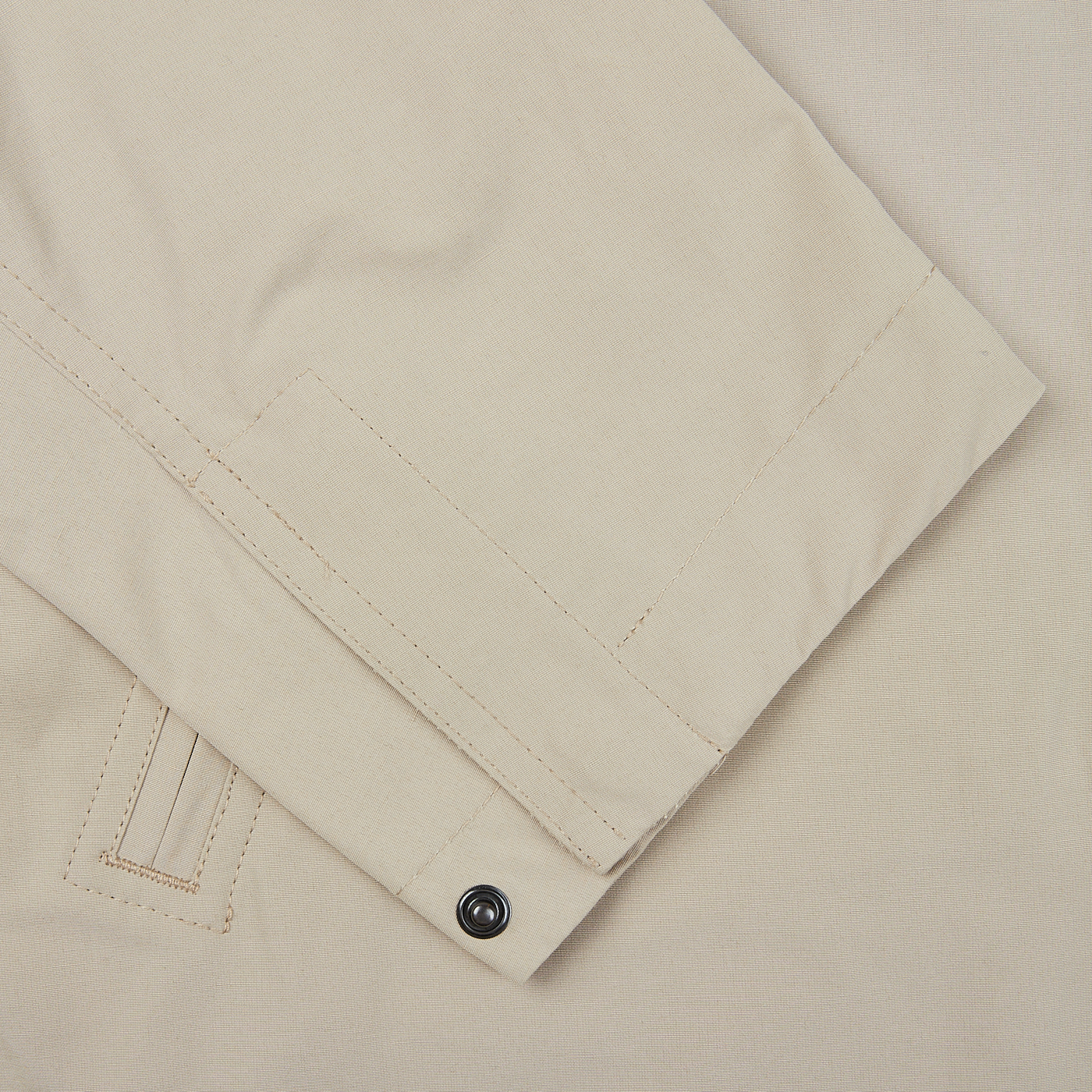 A close up image of a beige Aspesi Beige Cotton Canvas Windbraker Stringa Jacket.
