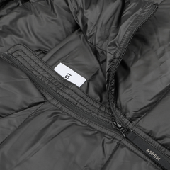 Close-up of a Black Nylon Ripstop Down Padded Budd Jacket by Aspesi, showcasing a partially open zipper that reveals a white tag inside. The jacket is constructed with durable nylon ripstop fabric for enhanced resilience.