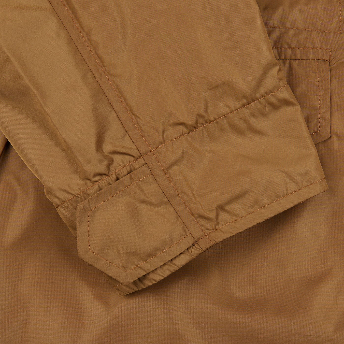 A close up of a tan Amber Brown Recycled Nylon Field Jacket by Aspesi.