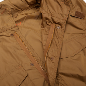 A close up of a tan Aspesi Amber Brown Recycled Nylon Field Jacket with zippers.