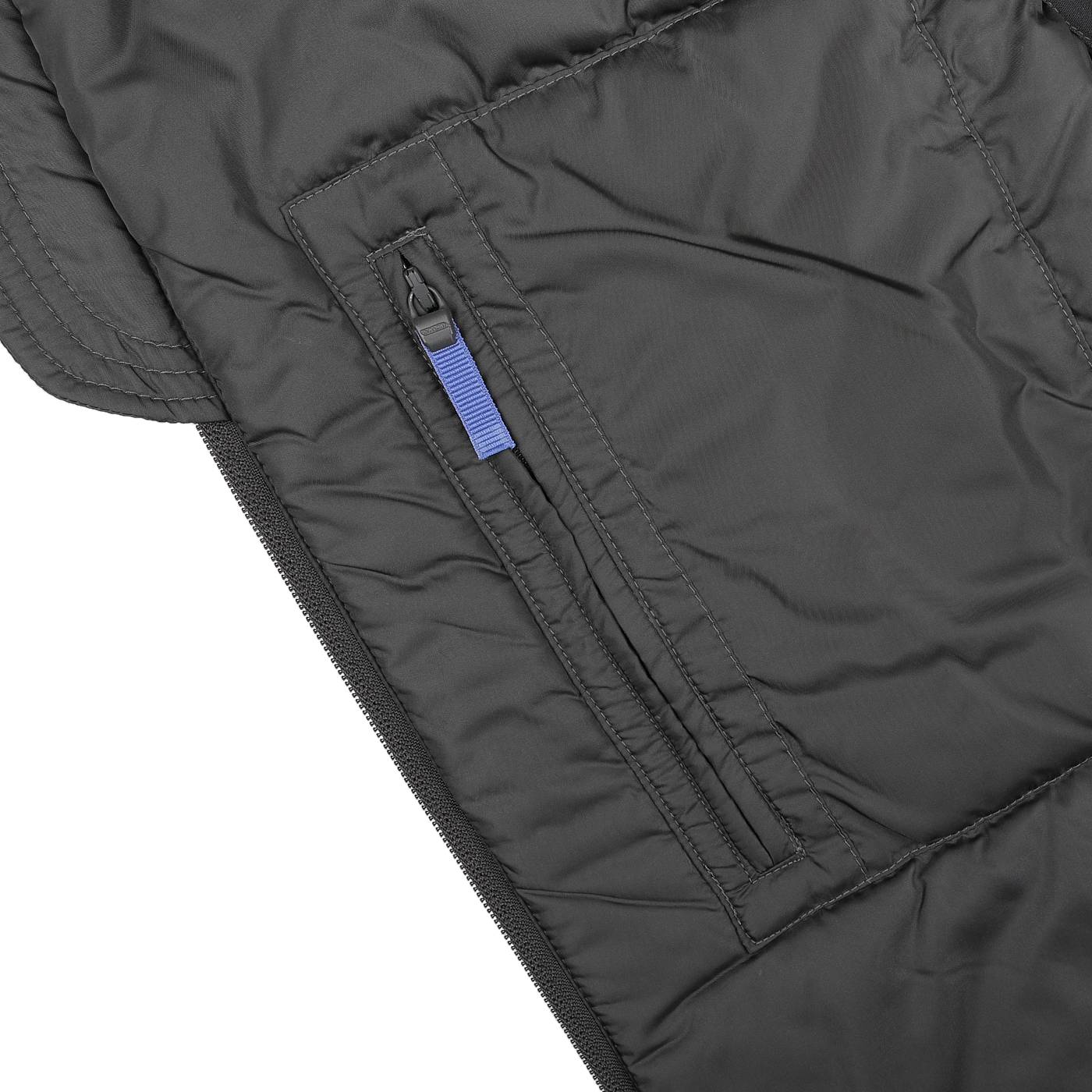 Detailed view of the side pocket on a charcoal grey gilet with a zipper and blue pull tab. The quilted gilet, known as the Charcoal Grey Nylon Taffetta Thermore Jil Gilet by Aspesi, is constructed from water-repellent nylon taffeta and features visible stitching patterns for enhanced style and durability.