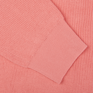 A close up image of a Coral Pink Knitted Cotton Aspesi sweater.