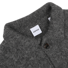 Close-up of an Aspesi Dark Grey Brushed Shetland Wool Cardigan, showcasing a button detail and featuring the brand tag on the collar, subtly complemented by navy blue accents.