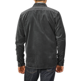 A person wearing an Aspesi Dark Grey Cotton Velvet Overshirt and blue jeans, photographed from the back, standing against a plain light gray background.