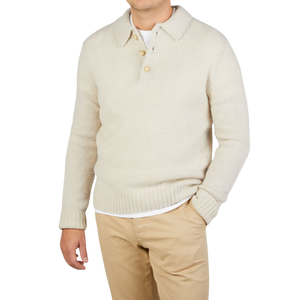A man wearing an Aspesi Ecru Beige Shetland Wool Polo Shirt.