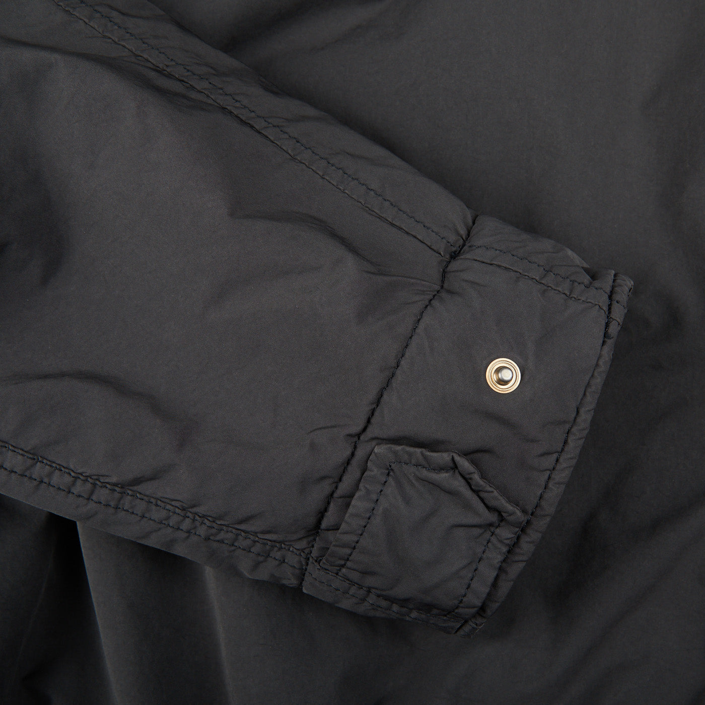 A close up of a black Aspesi Grey Luxury Nylon Padded Field Jacket.