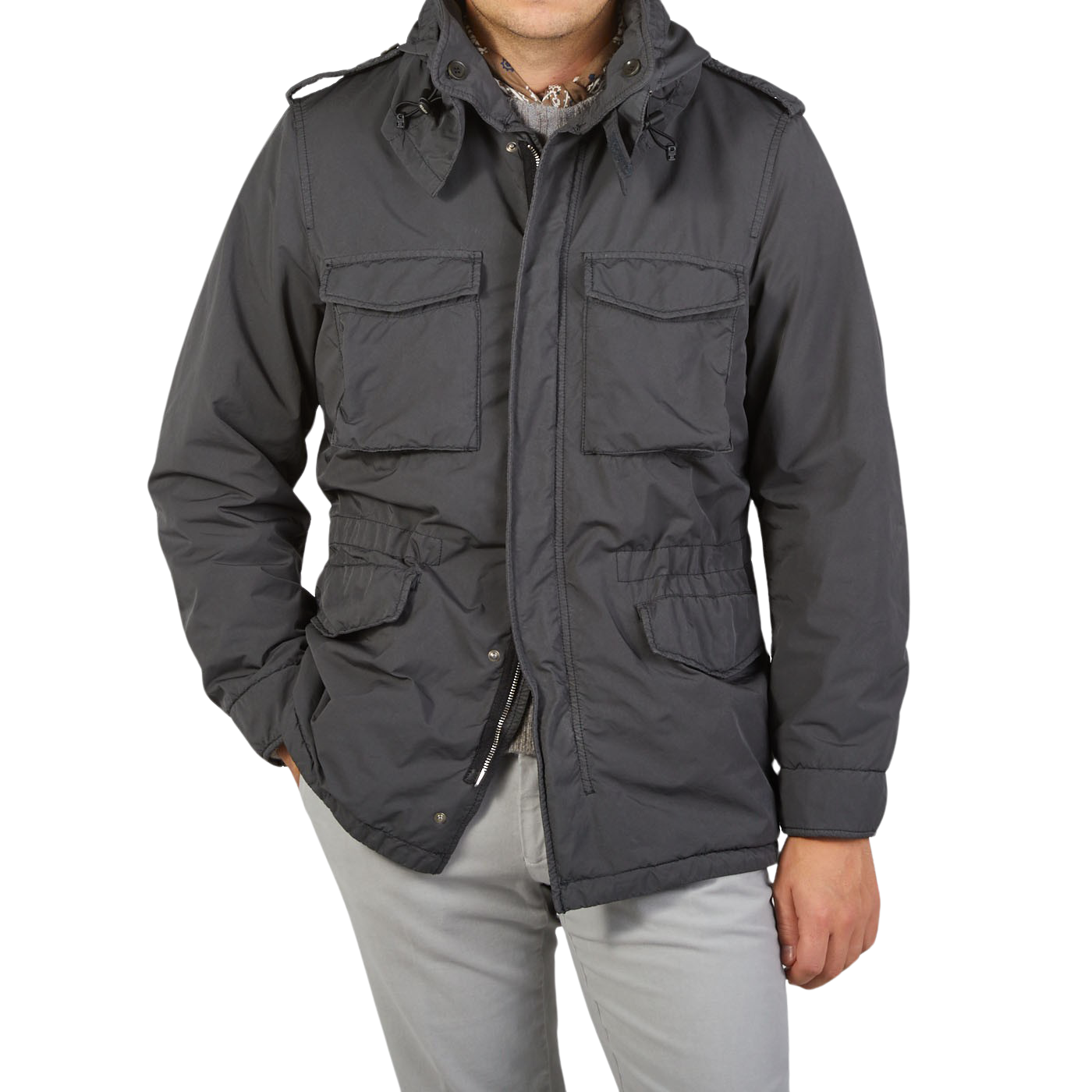 A man is posing in a Aspesi Grey Luxury Nylon Padded Field Jacket.