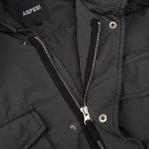 A close up of the Aspesi Grey Nylon Padded Field Jacket zipper.