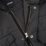 A close-up of the zipper on a black Aspesi Grey Luxury Nylon Padded Field Jacket.