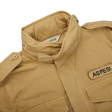 A Aspesi khaki beige cotton mini field jacket with the word Aspesi on it.