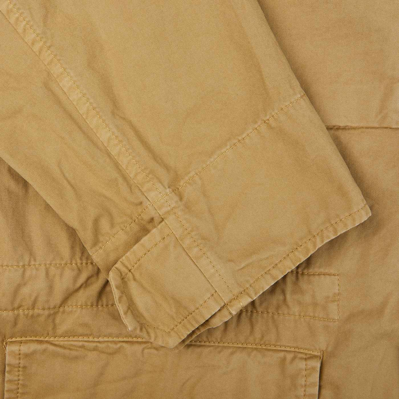 A close up of an Aspesi Khaki Beige Cotton Mini Field Jacket on a white background.