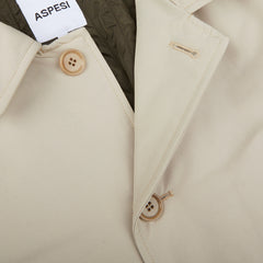 A close-up of a Light Beige Cotton Thermore Impermeabile coat by Aspesi.