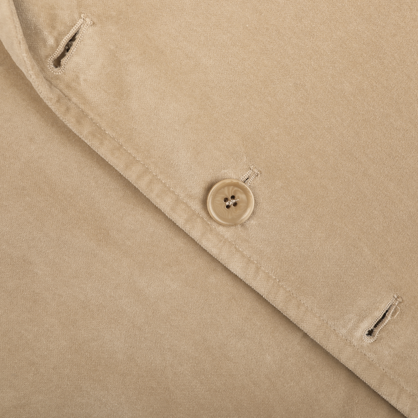 Close-up of the Light Beige Cotton Velvet Isaac Blazer by Aspesi, featuring visible buttonholes and a round button.