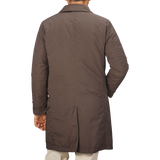 An individual is seen from behind wearing the Marrone Brown Micro Nylon Thermore Coat by Aspesi.