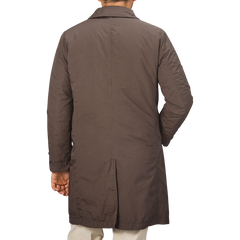 An individual is seen from behind wearing the Marrone Brown Micro Nylon Thermore Coat by Aspesi.