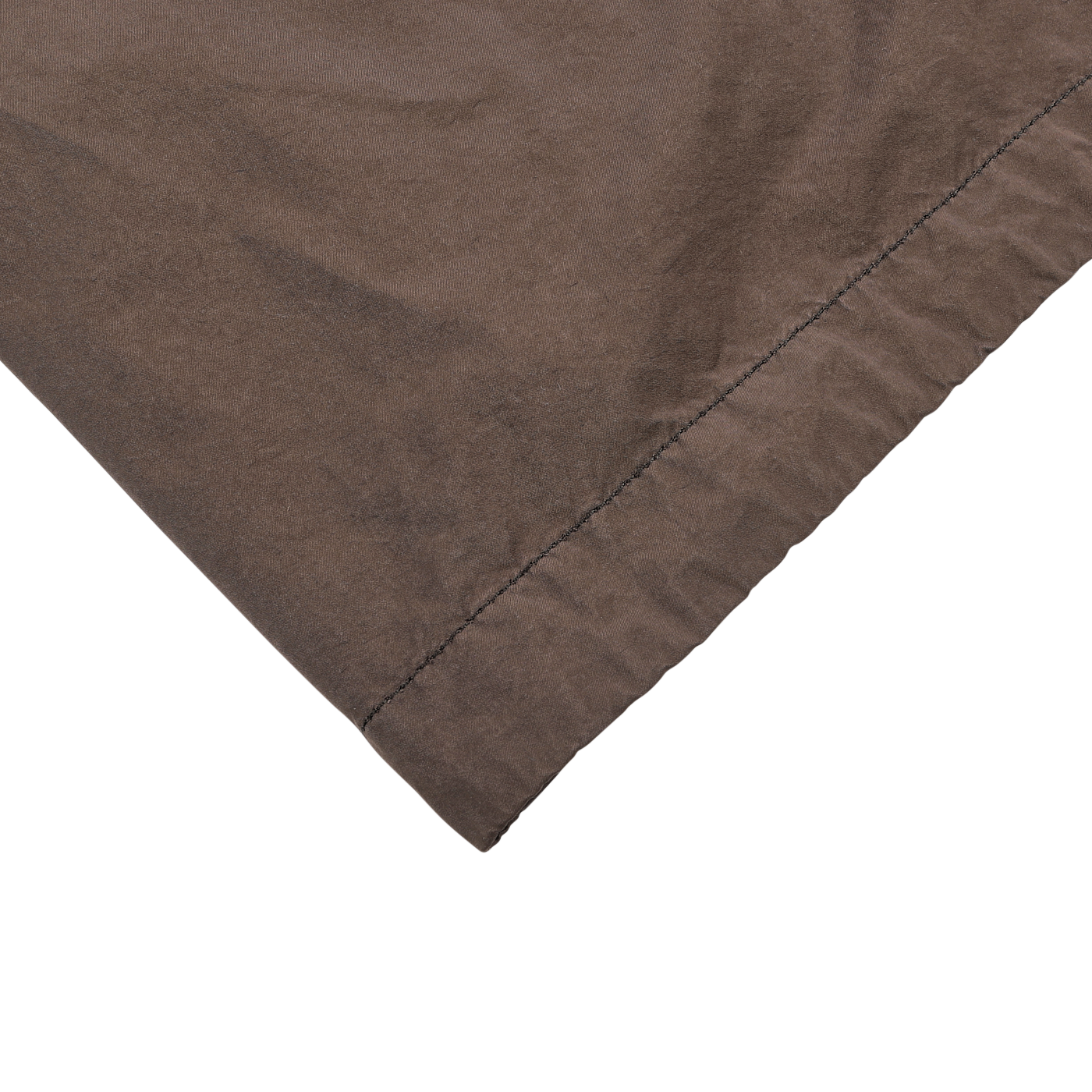 A close-up of the Marrone Brown Micro Nylon Thermore Coat by Aspesi, showcasing its fine stitching along the edge and emphasizing the technical nylon weave, set against a light gray background.