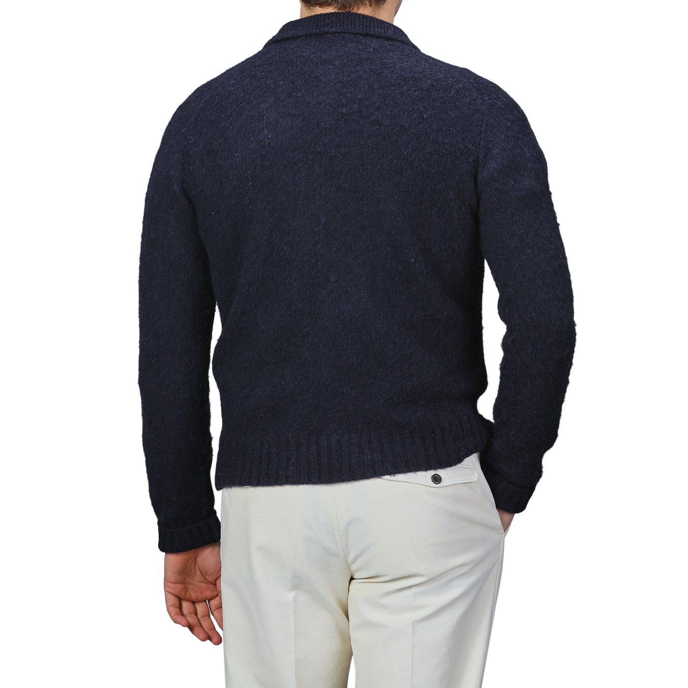 A man is shown from the back against a plain background, wearing an Aspesi Navy Blue Brushed Shetland Wool Cardigan and light-colored pants.