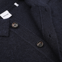 Close-up of the Aspesi Navy Blue Brushed Shetland Wool Cardigan, showcasing brown buttons and a visible label on the collar.