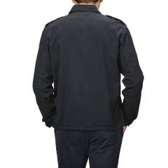 A person wearing the Aspesi Navy Blue Cotton Twill Field Shirt, which has a regular fit, stands facing away from the camera against a gray background.