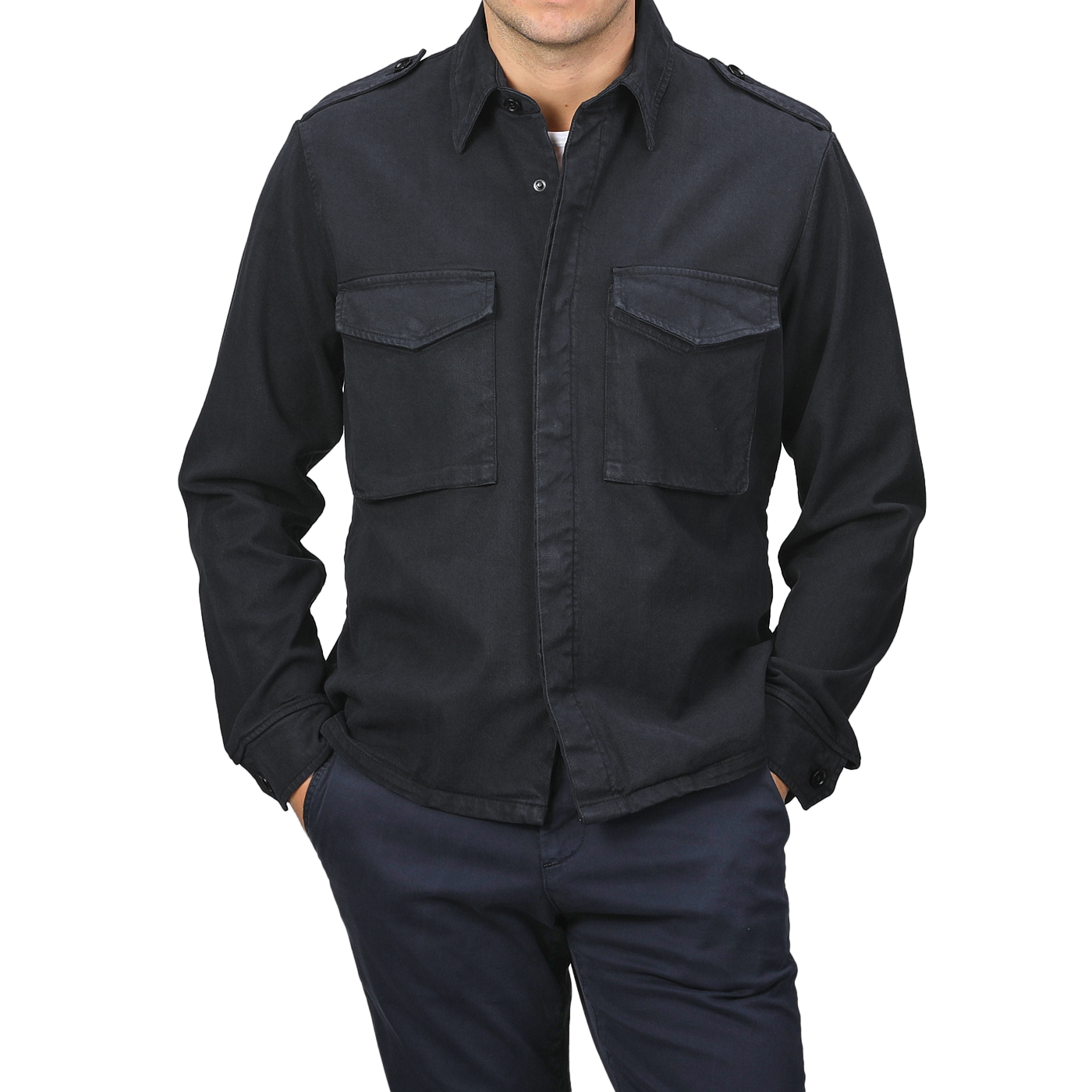 A person wearing the Navy Blue Cotton Twill Field Shirt by Aspesi, characterized by its regular fit and cotton-lyocell blend with two chest pockets, paired with dark pants and hands in pockets.