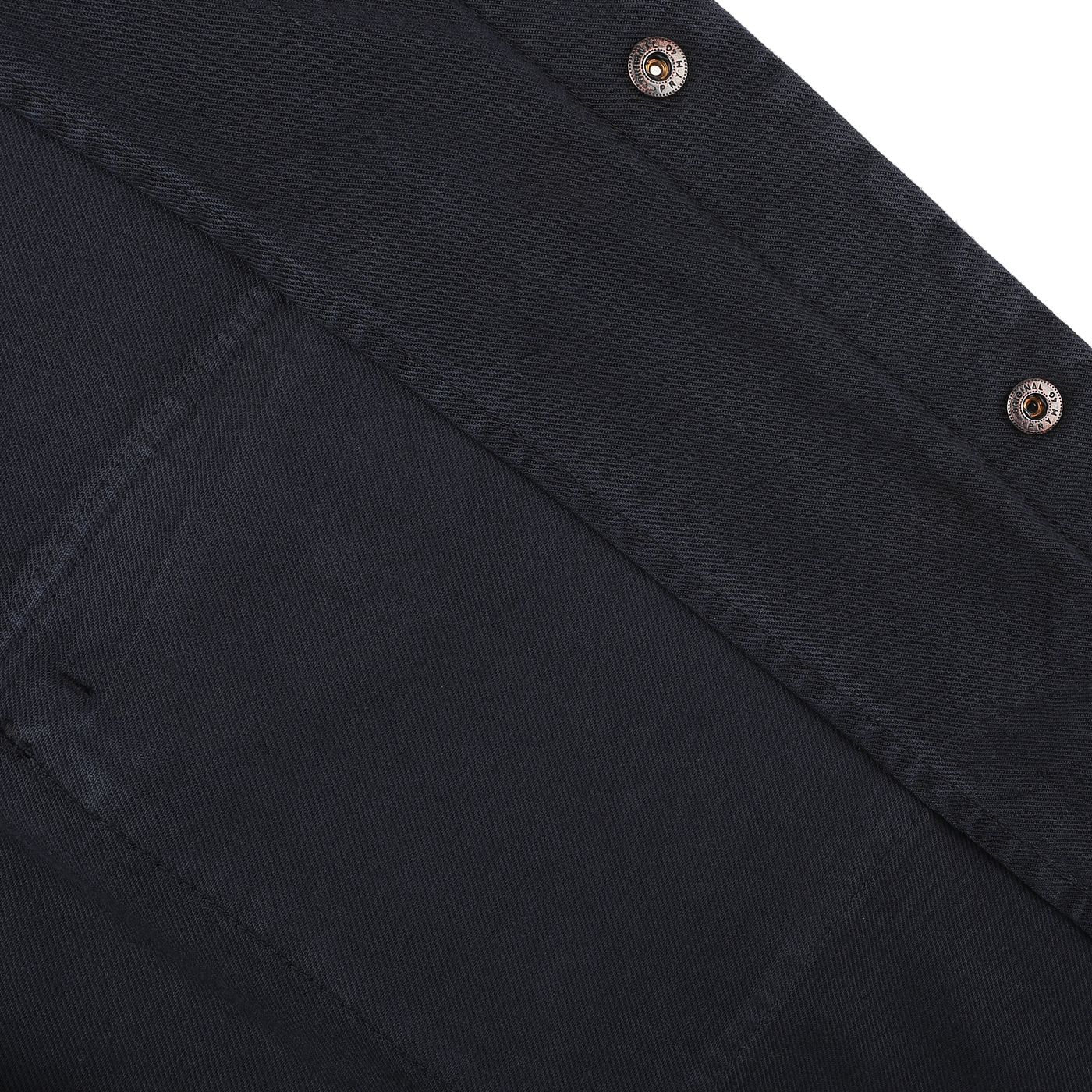 Close-up of the Aspesi Navy Blue Cotton Twill Field Shirt, crafted from a cotton-lyocell blend. This regular fit shirt showcases visible stitching and two metal snap buttons, highlighting the defined texture and weave of the material.