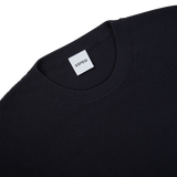The back of a navy blue knitted cotton sweater with a label on it by Aspesi.