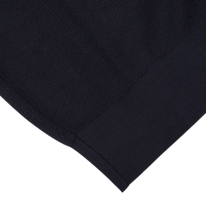 A close up of a navy blue Aspesi knitted cotton sweater.