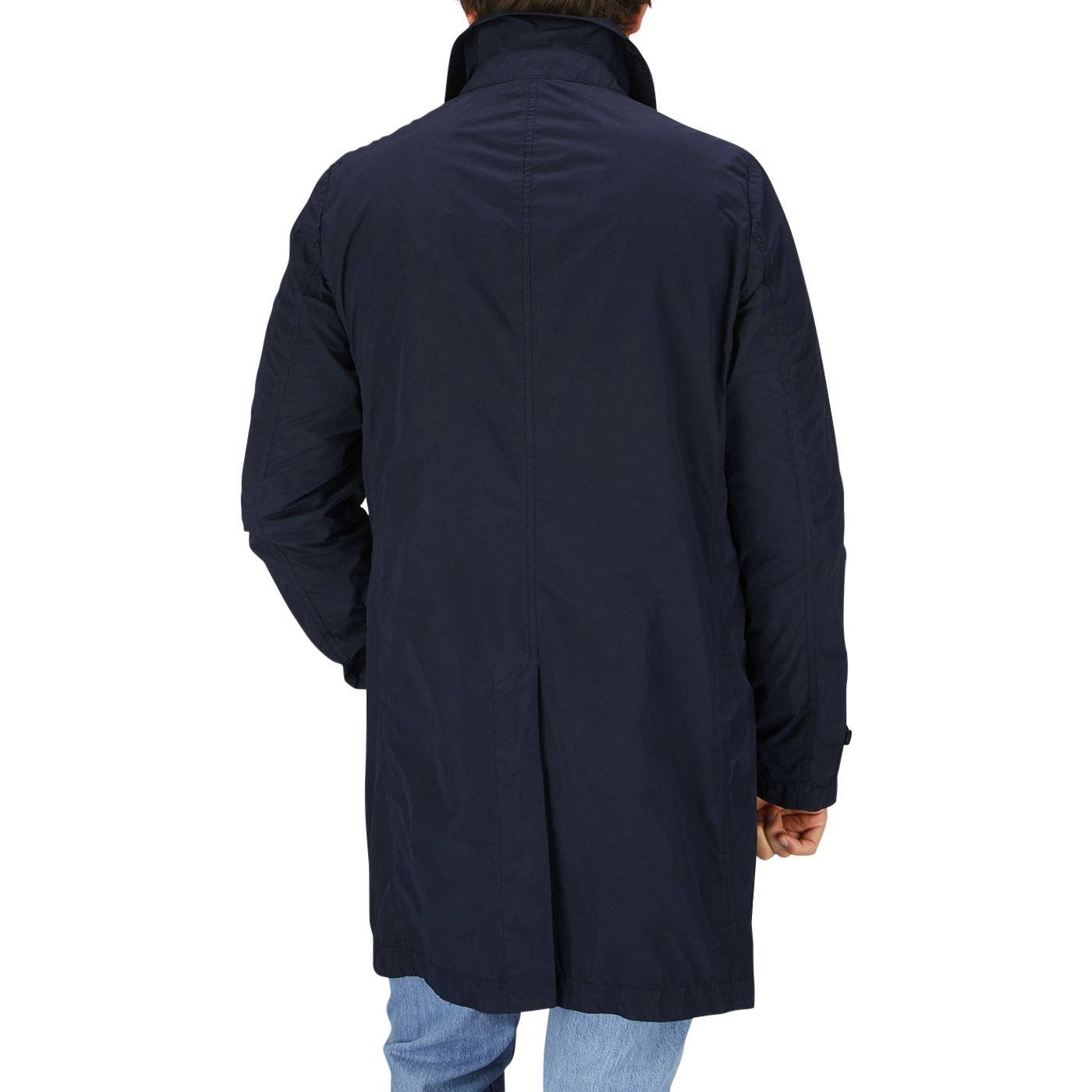 The back view of a man wearing a Aspesi Navy Blue Micro Nylon Limone Coat.