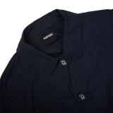 The back of an Aspesi Navy Blue Micro Nylon Limone Coat with a button on the front, designed as a weather-resistant technical coat.