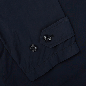 A close-up image of an Aspesi Navy Blue Micro Nylon Limone Coat with buttons.