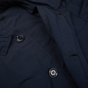 A close up of a Navy Blue Micro Nylon Limone Coat jacket with buttons by Aspesi.