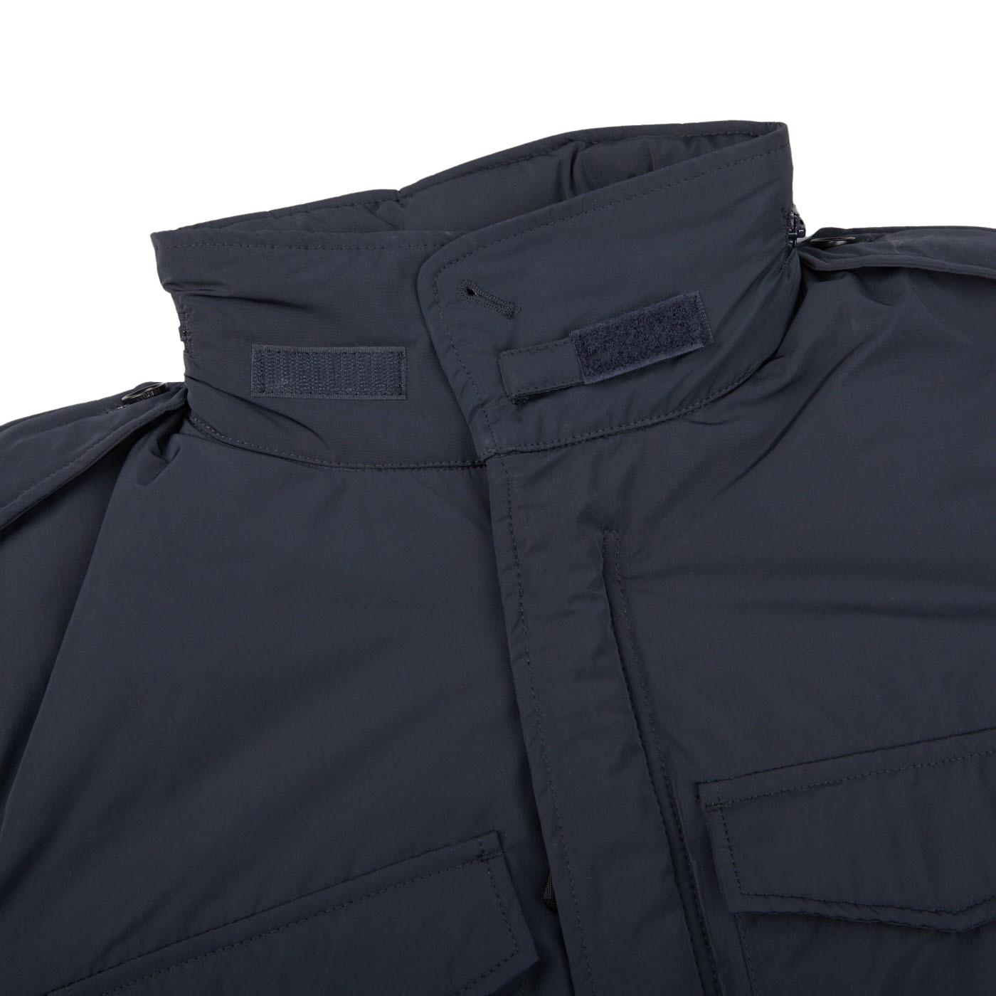 A close up of an Aspesi navy blue Nylon Padded Field Jacket on a white background.